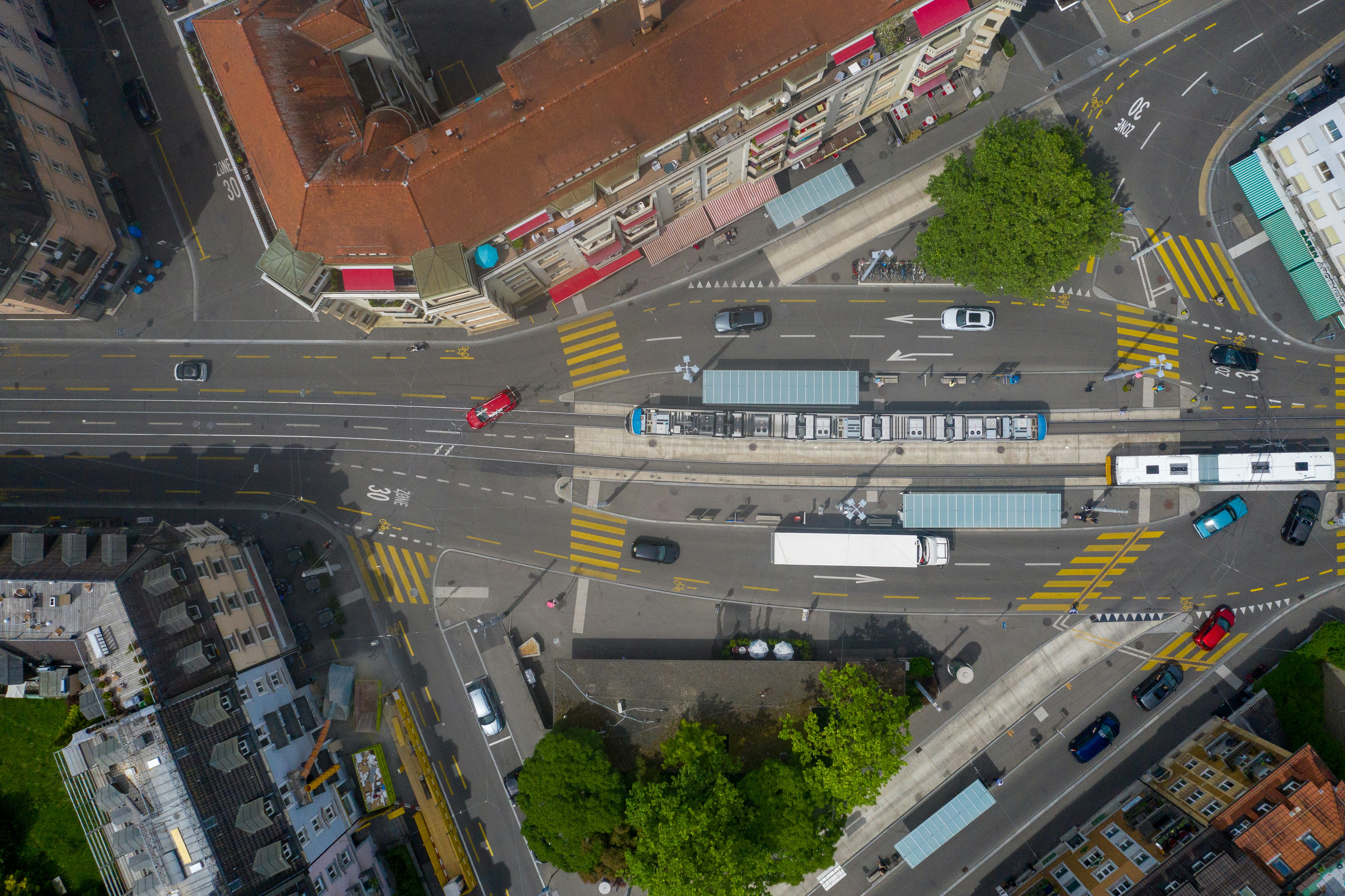 cars on road near buildings during daytime